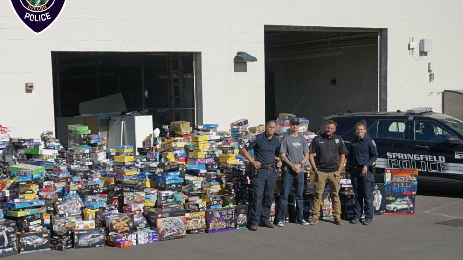 Lego sets stacked up in front of a building.