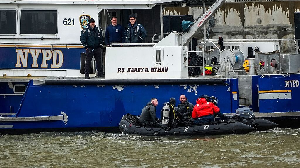 Police search site of a helicopter crash in the Hudson River.