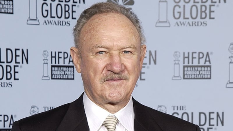 Gene Hackman holding the Cecil B. DeMille Award at the Golden Globes Awards in 2003.